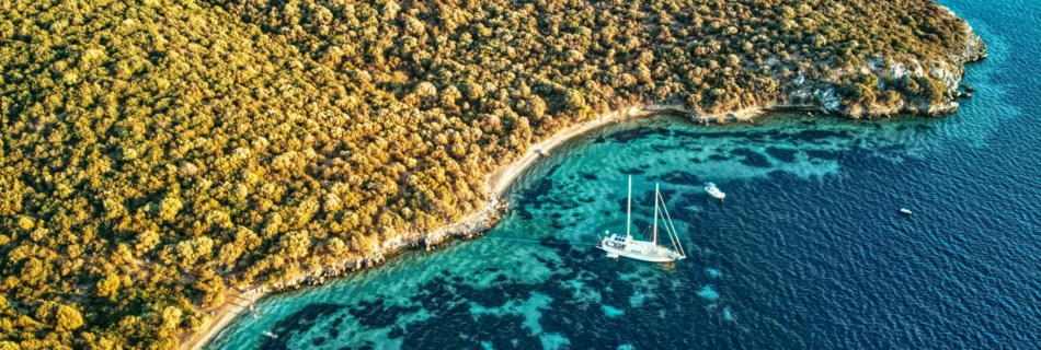 A stunning aerial view of Bodrum's coastline with serene waters and sailboats, perfect for travel enthusiasts.